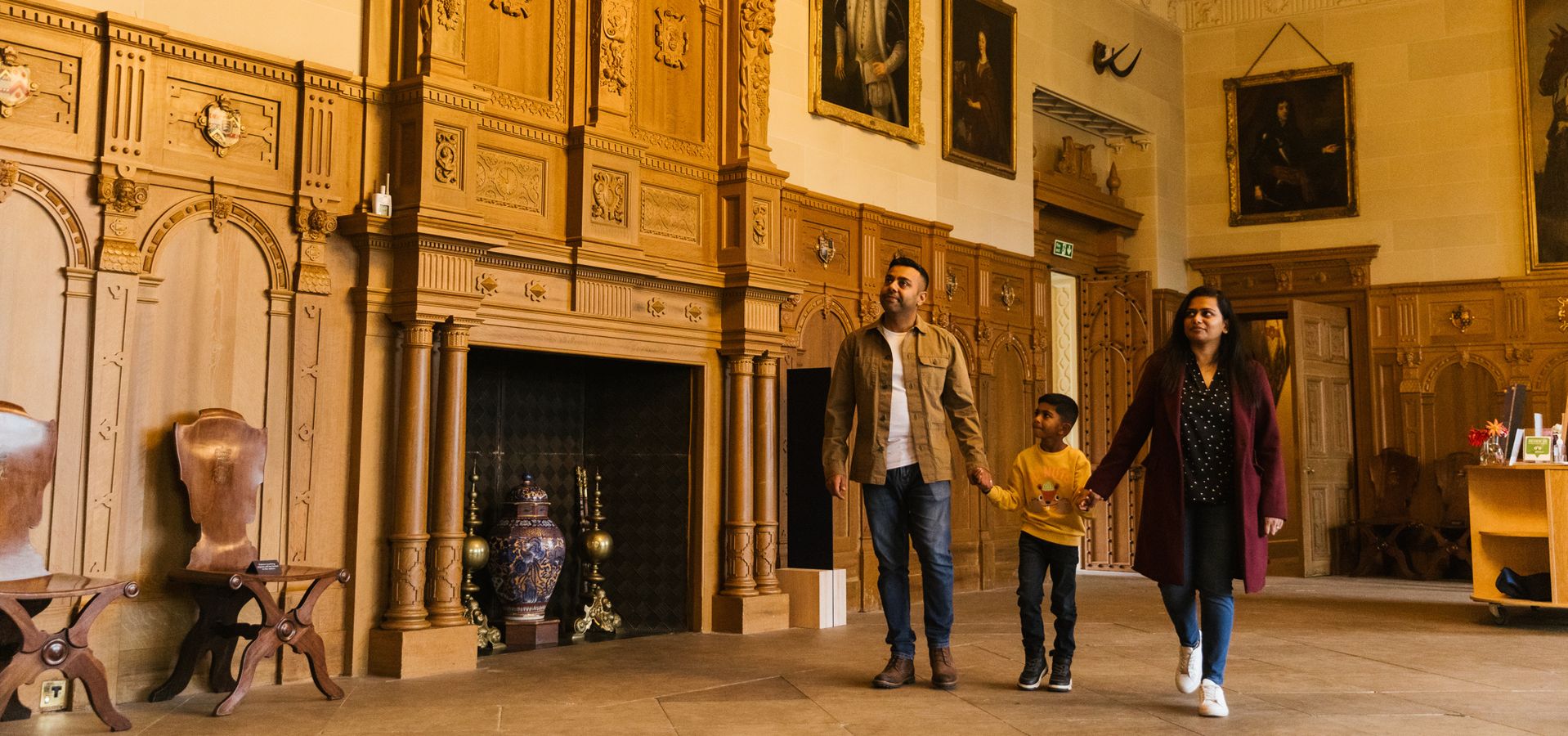 A family explore Temple Newsam house.