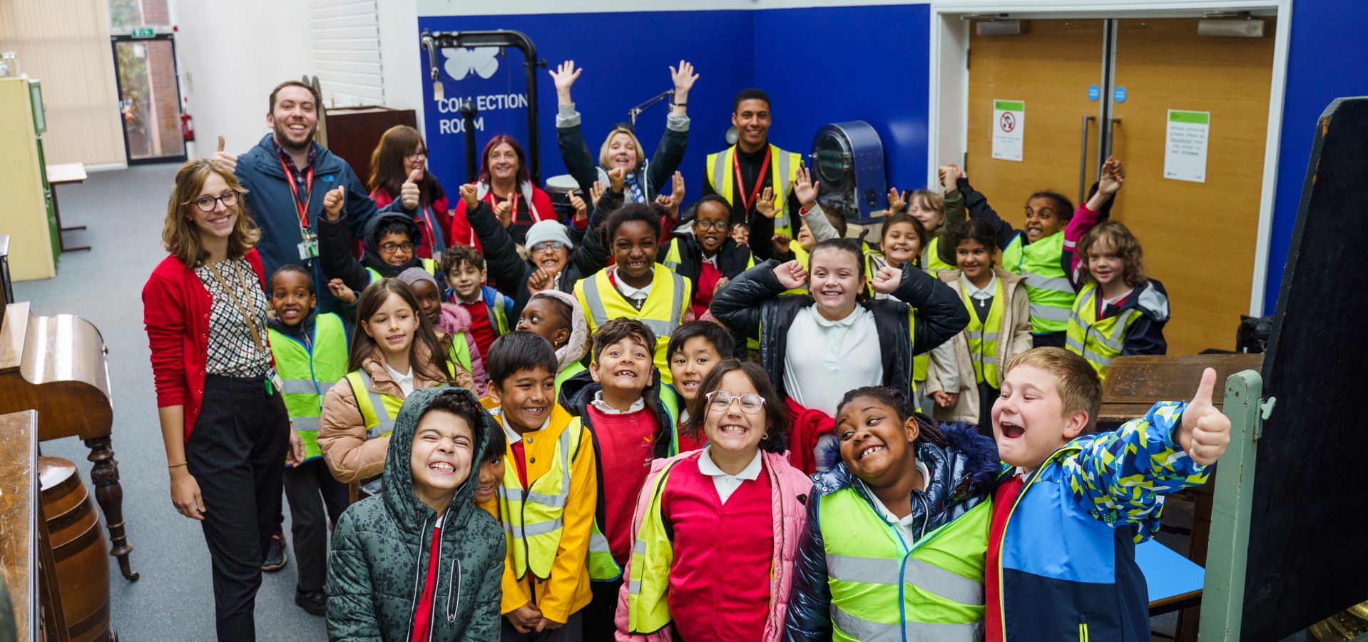 A class visiting the Leeds Discovery Centre smile for the camera