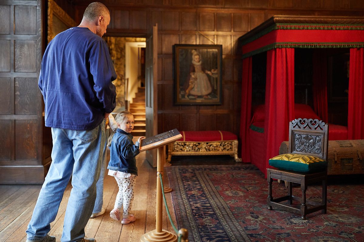 An adult and child looking around Temple Newsam