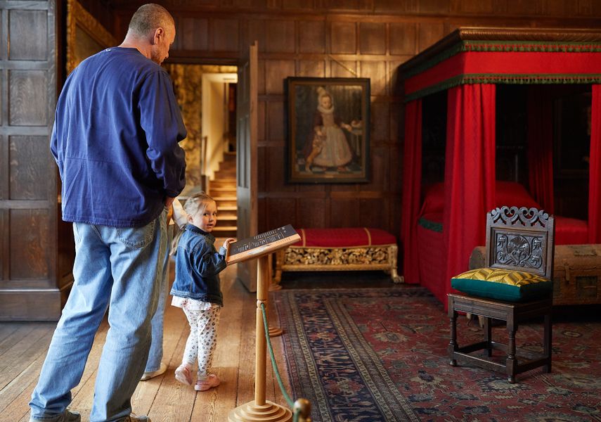 An adult and child looking around Temple Newsam