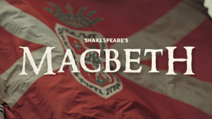 The play's title, Macbeth, over the image of hands waving a red flag with a white cross and coat of arms.