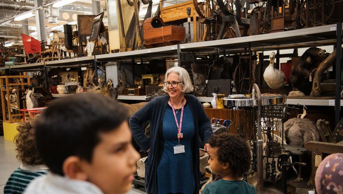 A curator with a tour group in Leeds Discovery Centre's Collection Store