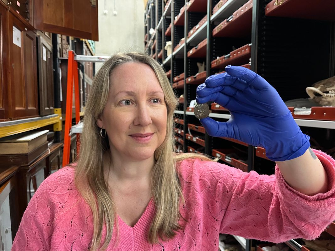 Kat Baxter, Leeds Museums and Galleries' curator of archaeology and numismatics with the ancient coin now at Leeds Discovery Centre. The astonishing discovery, handed to an unwitting local bus driver in the 1950s, was produced by Carthaginians, part of the Phoenician culture, in the Spanish city of Cadiz during the 1st Century BC and has now kindly been donated to Leeds Museums and Galleries.