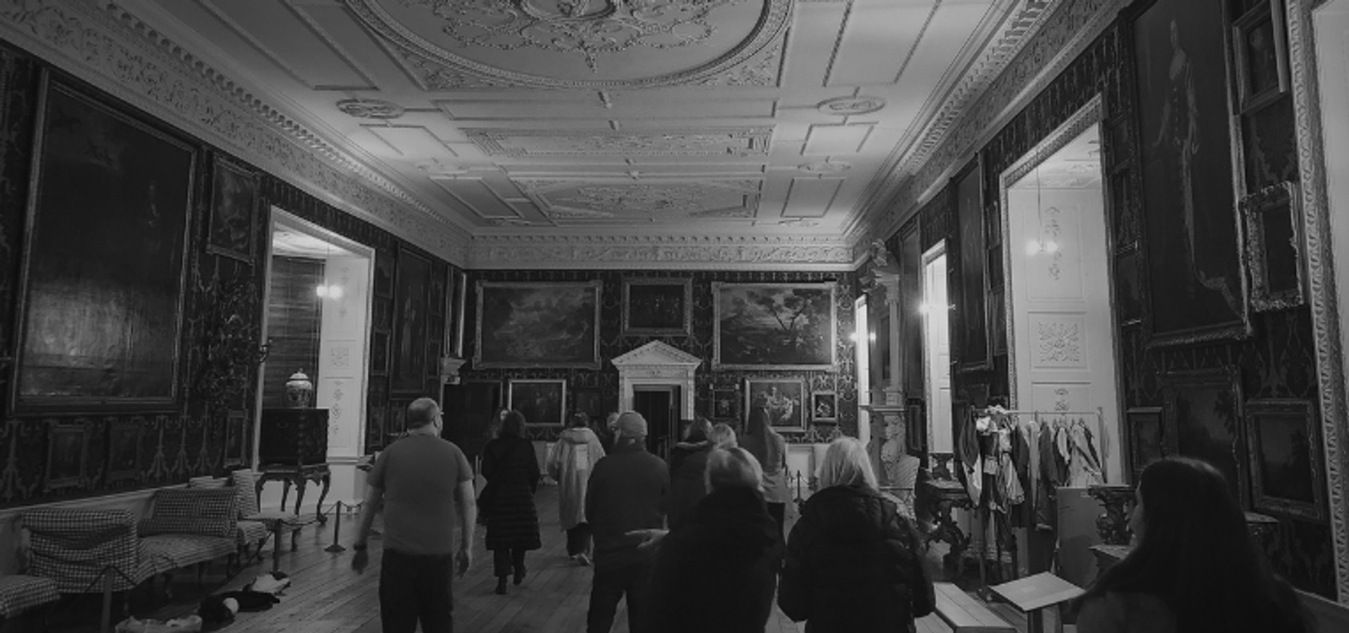 A dark image of a tour in the picture gallery at Temple Newsam