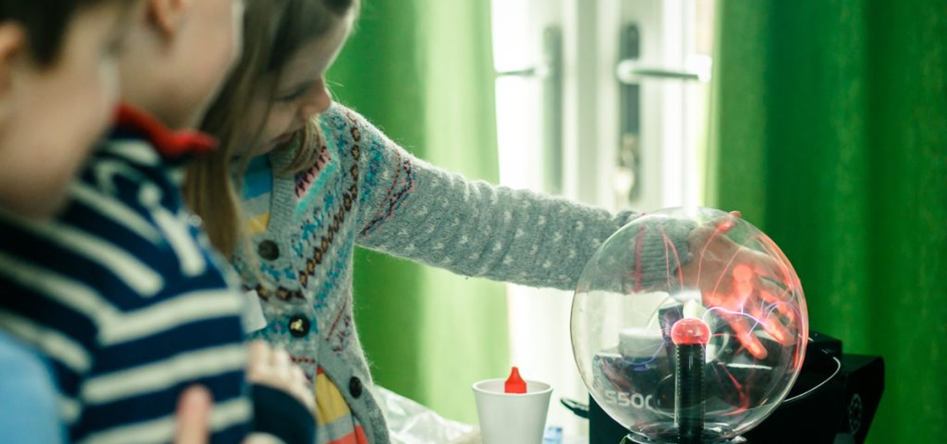 children playing with a glass ball