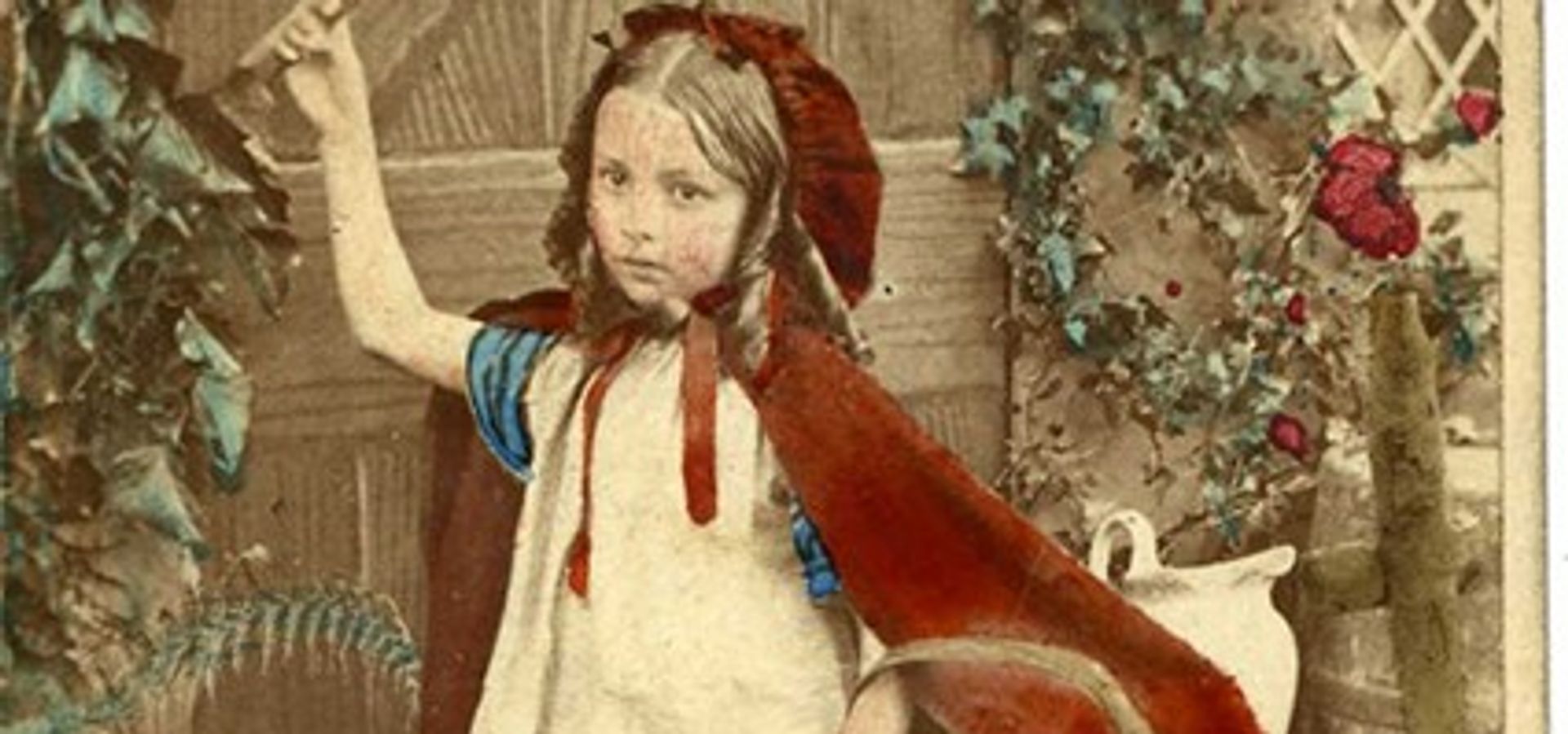 Illustration of Little Red Riding Hood in front of a cottage holding a basket