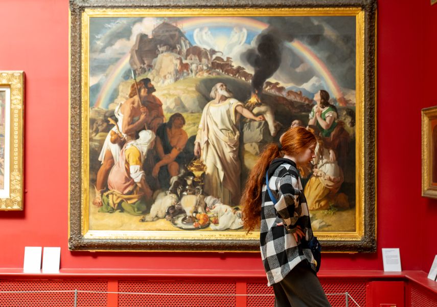 Person looking at paintings in Leeds Art Gallery