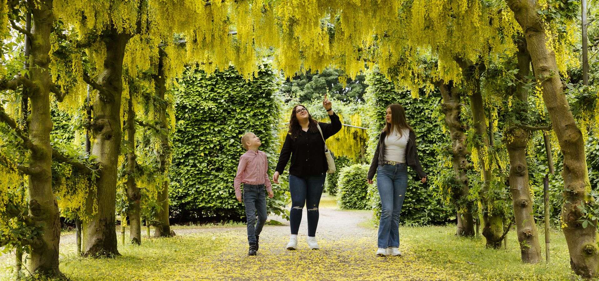 The gardens of Temple Newsam with visitors walking through