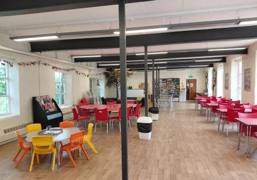 Photograph of hall with dining table and chairs