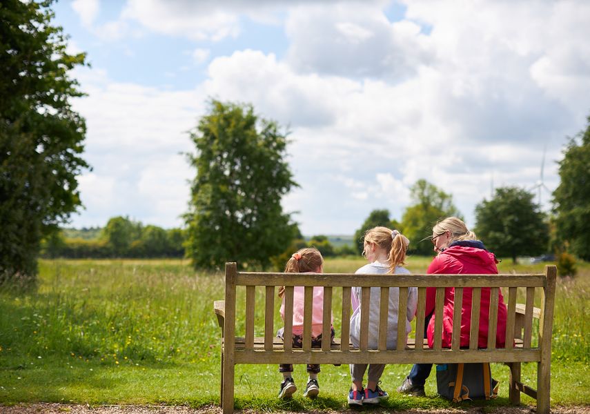 A family look out over a field at Lotherton