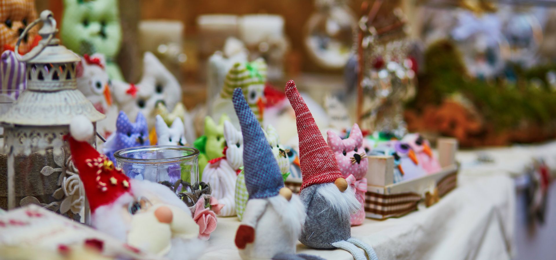 Gonks sat on the edge of a market stall