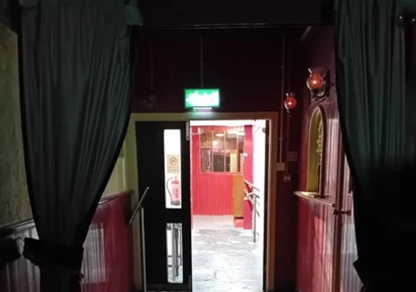 Photo of doorway with bright light shining through