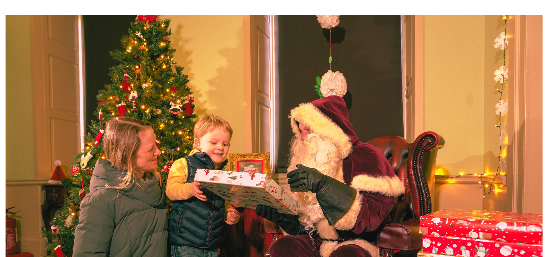A family visiting Father Christmas at Temple Newsam