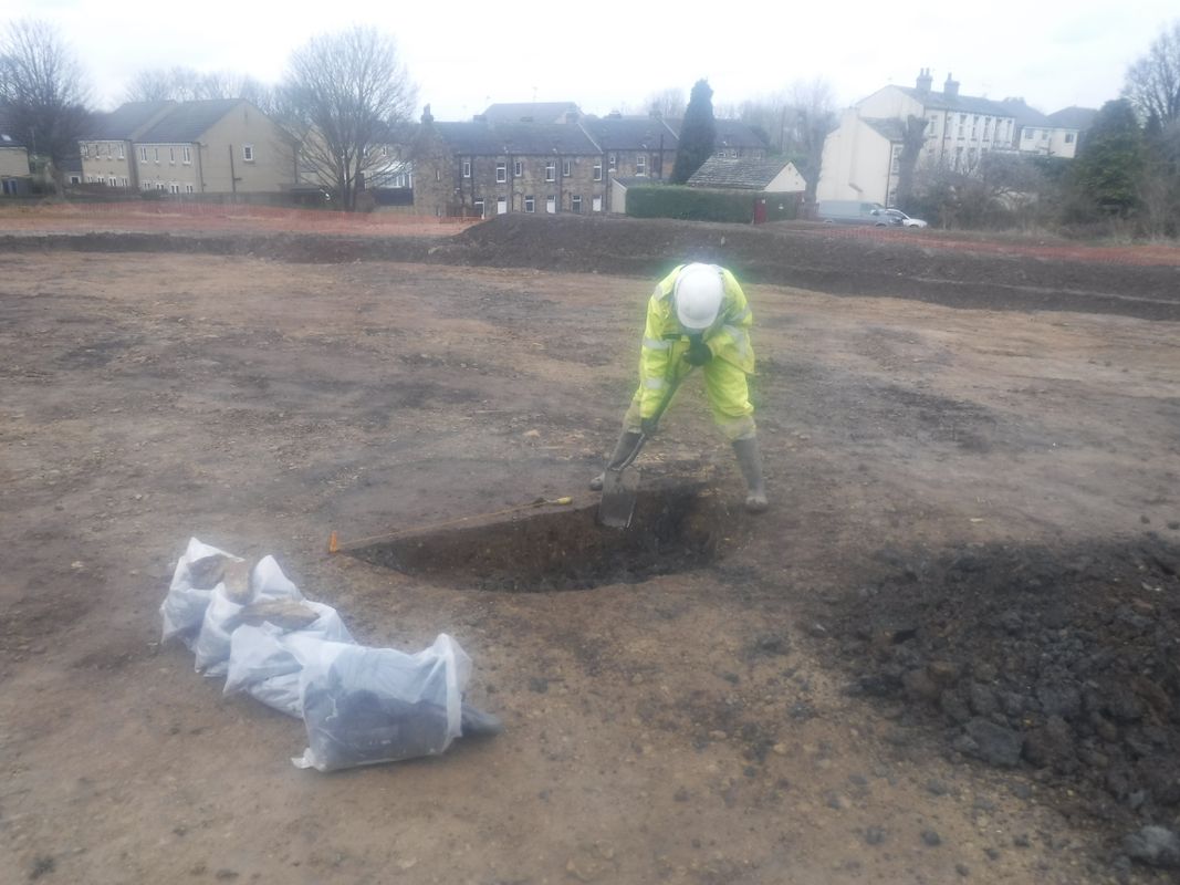 Archaeologists excavate the site at Pitty Close Farm in Leeds.