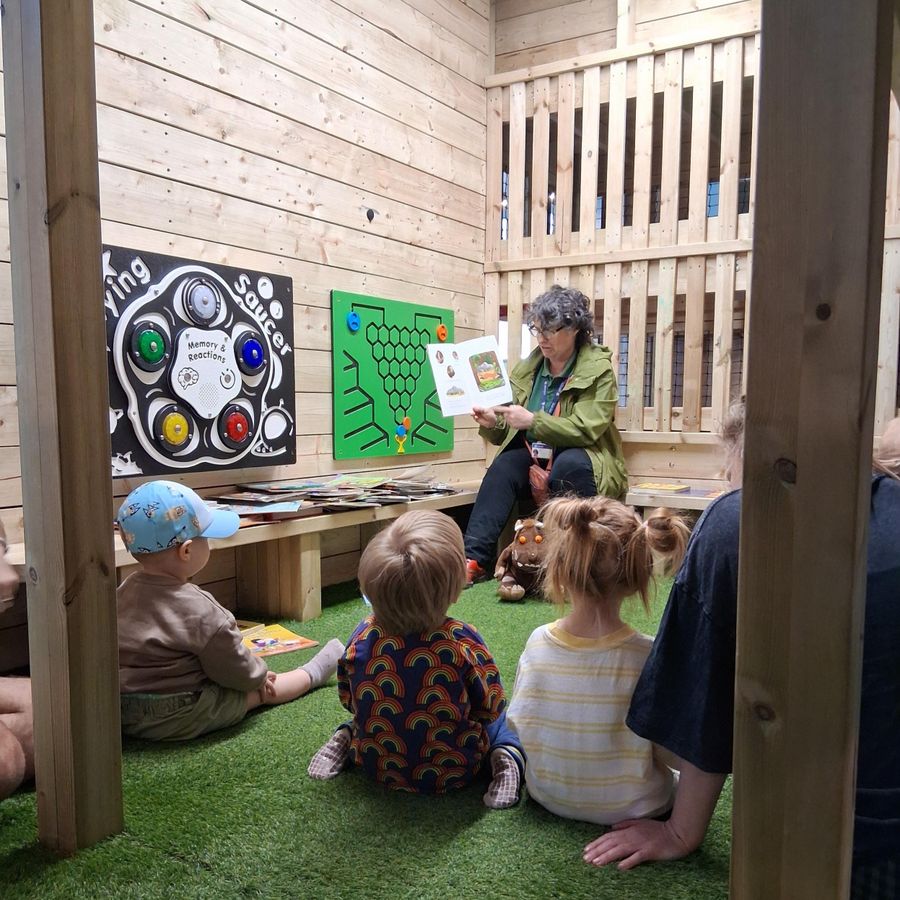 Children sitting listening to a story
