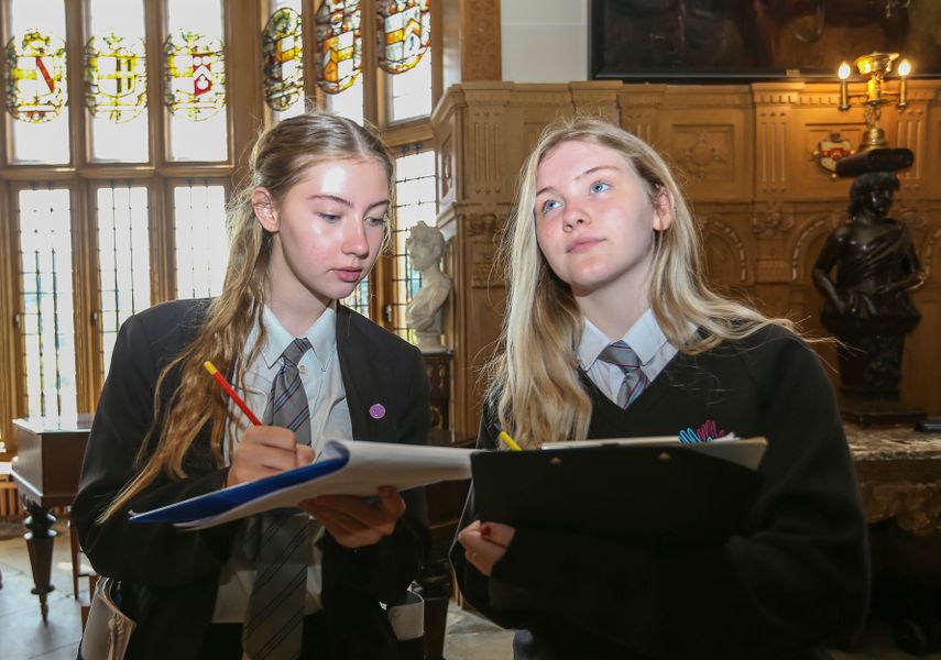 image of two students looking around temple newsam