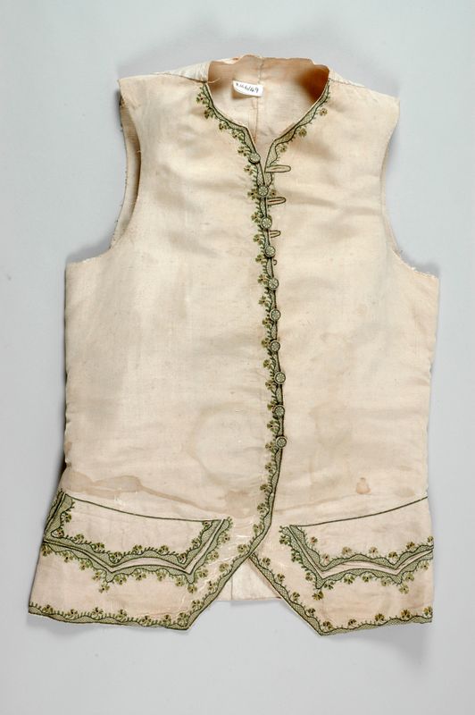 Waistcoat, 1760s made of a cream, ridged silk, possibly a Paduasoy, decorated with a hand embroidered design of flowers and leaves.   