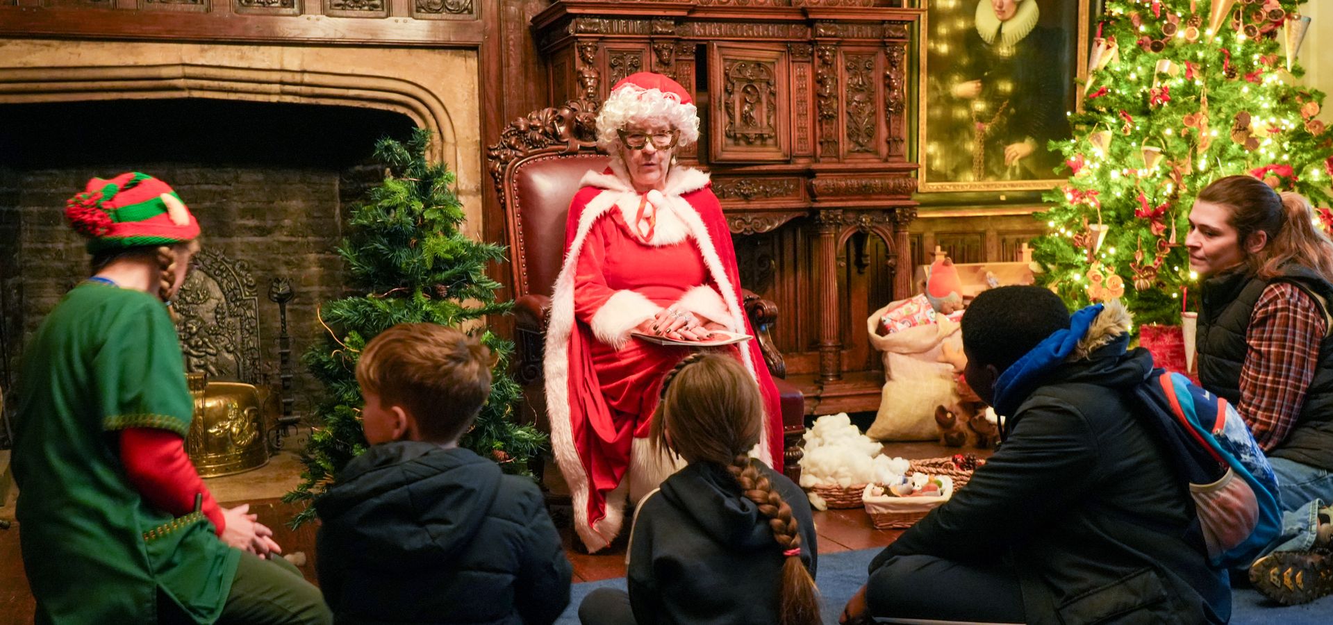 A group of people listening to festive storytime with Mrs Claus