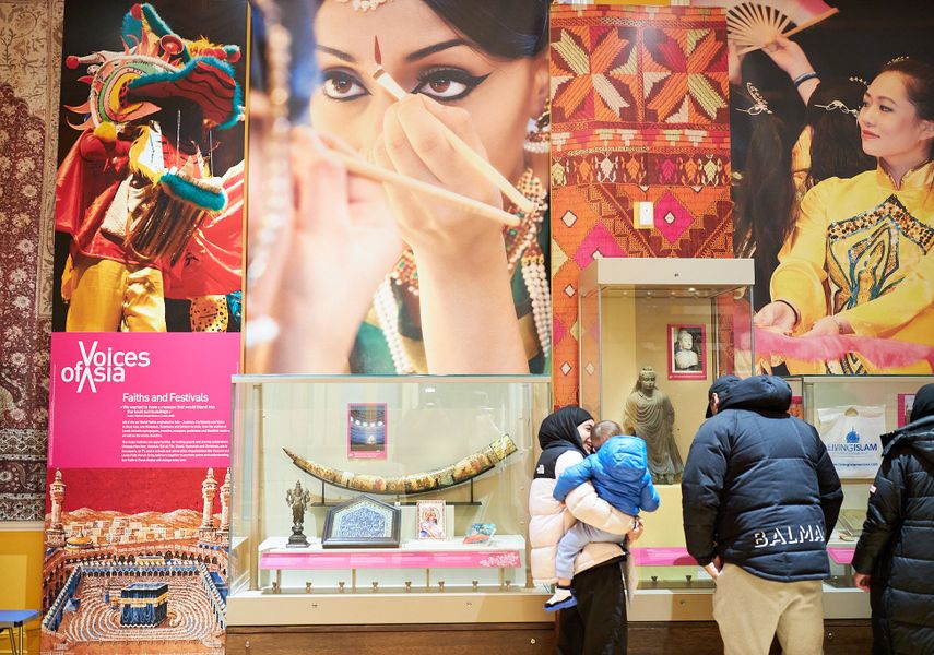 A display of Asian objects and photos