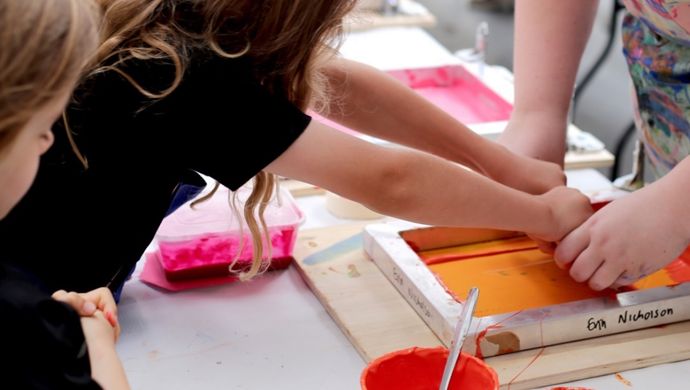 Children at a screen printing workshop