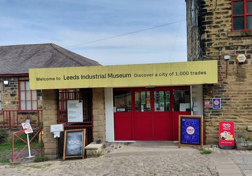 Entrance to Leeds Industrial Museum with yellow sign and red doors