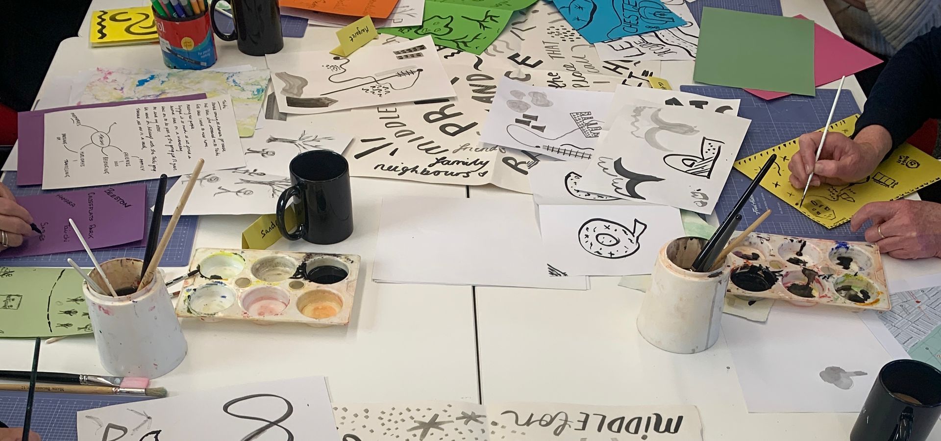 A table will illustrations and craft materials on