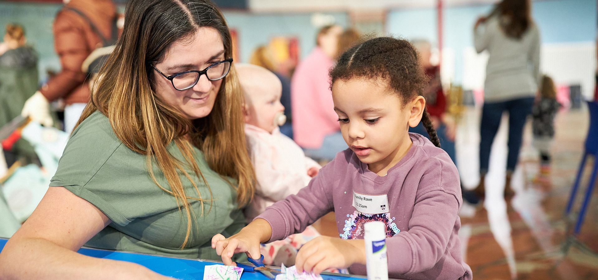 Child and parent doing crafts at Leeds City Museum