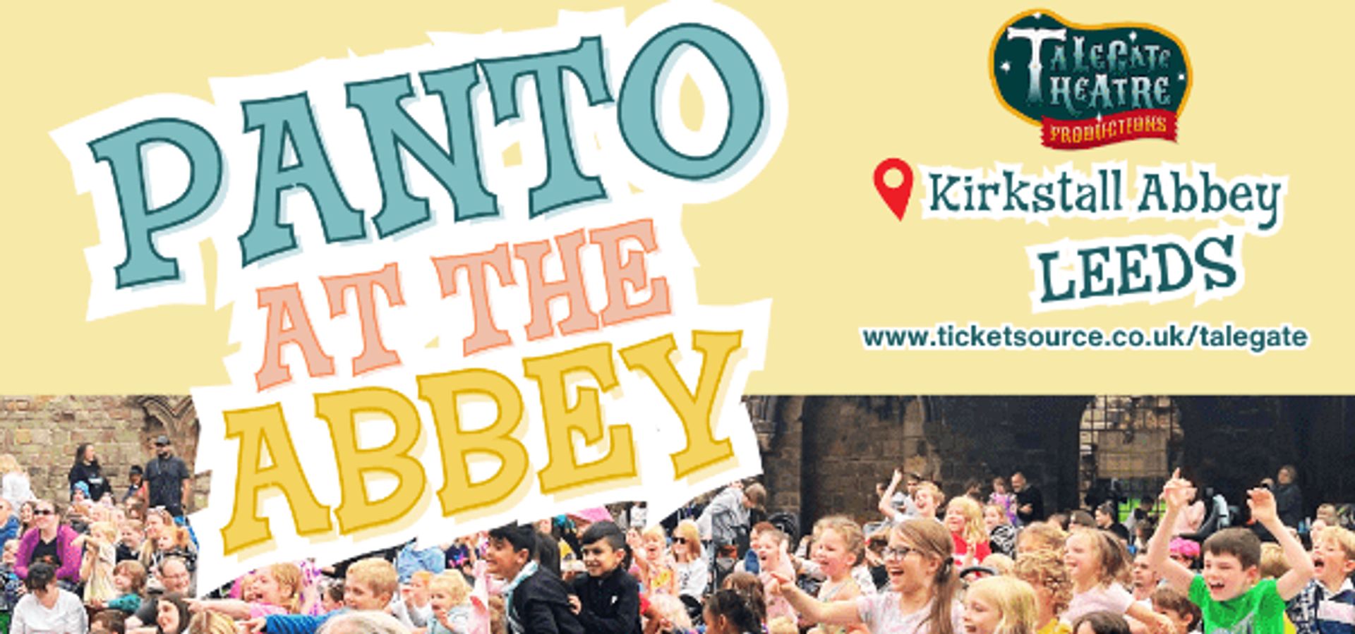 An audience of families with text reading "Panto at the Abbey"