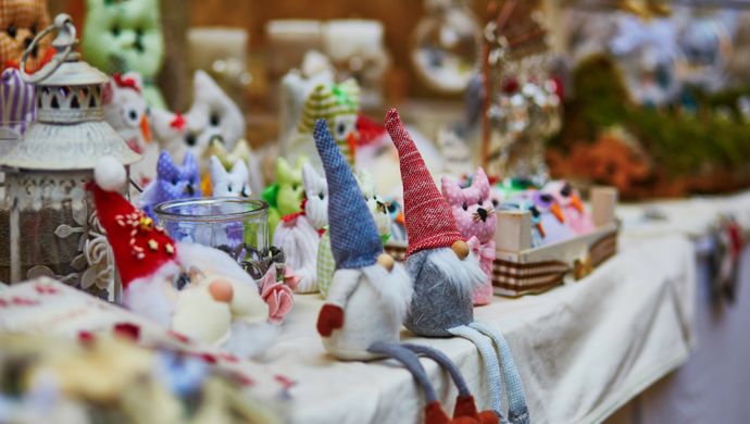 Gonks sat on the edge of a market stall