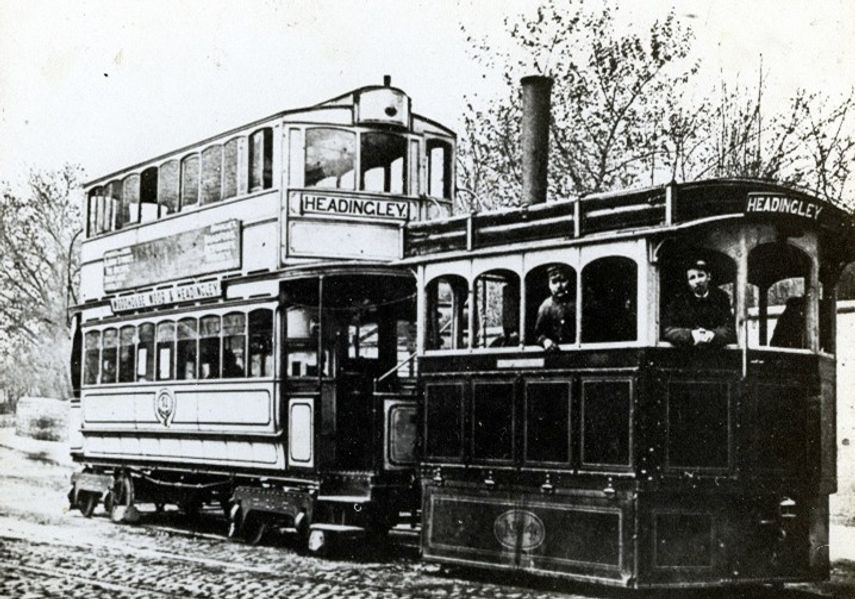 A black and white photography of a steam train being driven to Headingley