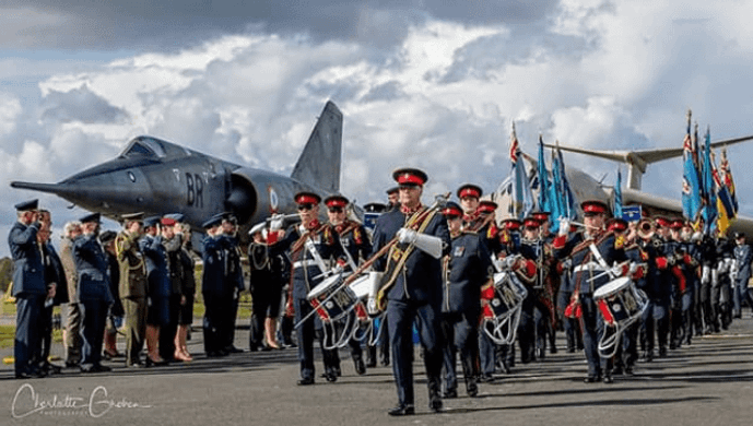 The Yorkshire Military Band in front of grounded planes