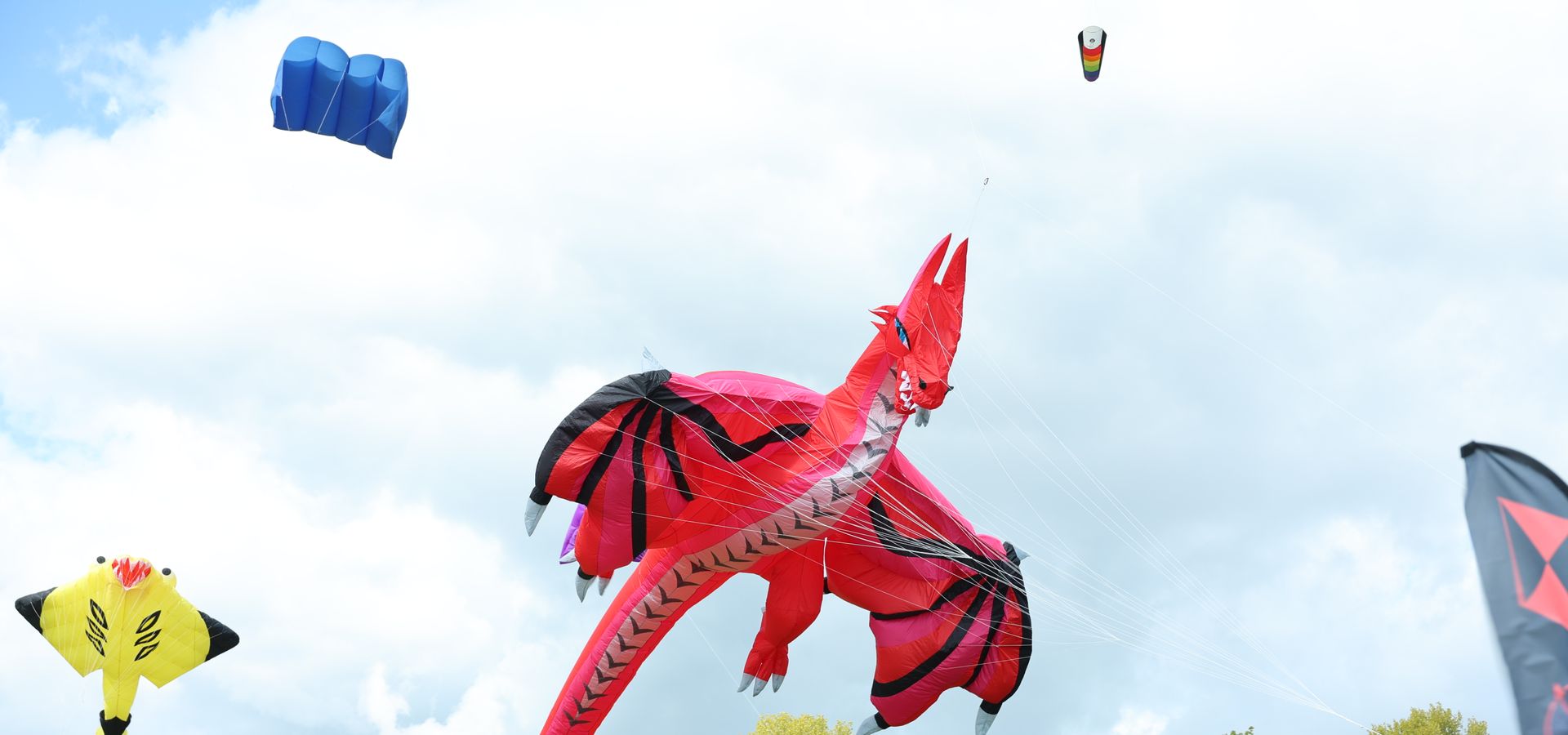 A red dragon kite in the sky