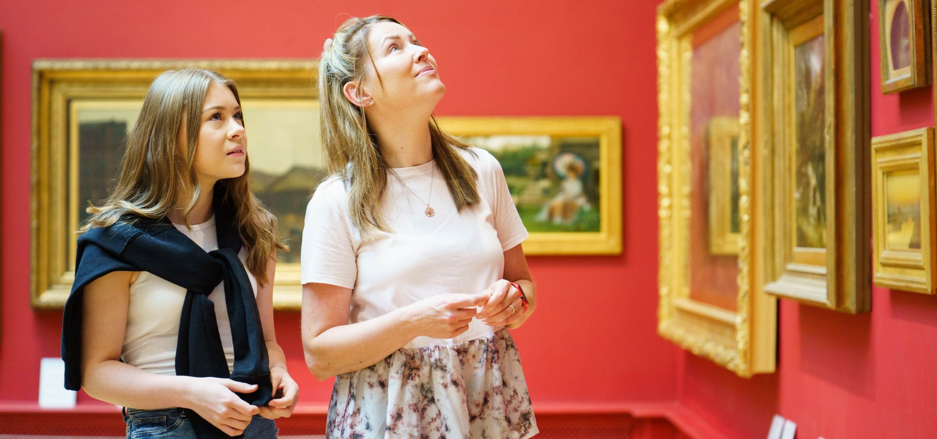 Two people looking at paintings in the Ziff gallery of Leeds Art Gallery