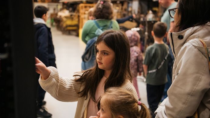 Two children and a tour group in Leeds Discovery Centre Collection Store
