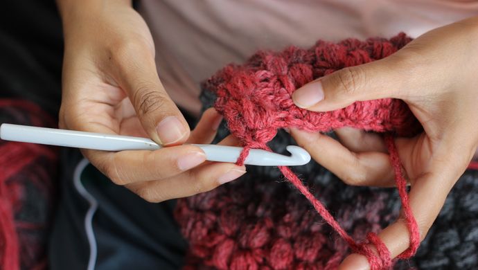 A person crocheting