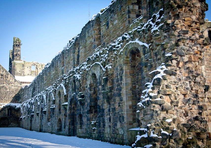 A ruined wall dusted with snow