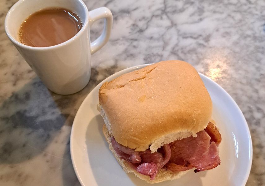 Bacon bap with a cup of tea