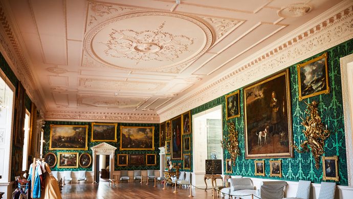 The Picture Gallery at Temple Newsam, with green wallpaper, a white ceiling and wooden floors
