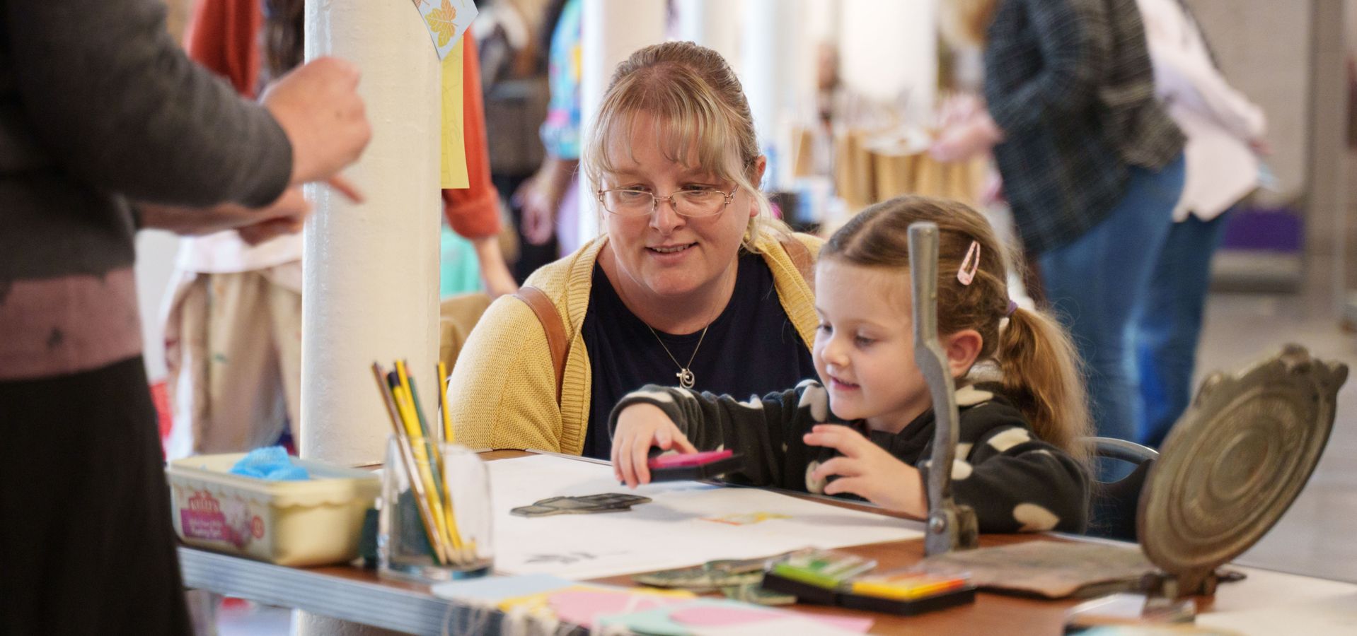 A woman and child doing a printing activity at Leeds Industrial Museum