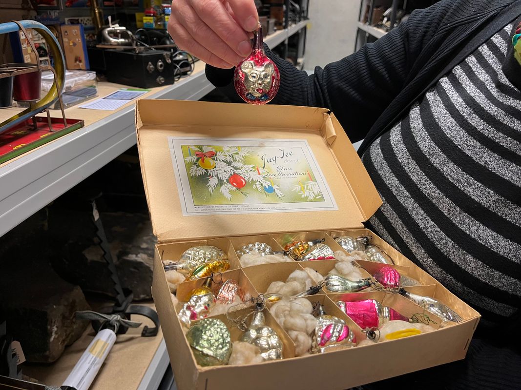 a set of Mickey Mouse Christmas tree lights as well as some brightly coloured glass baubles manufactured by Morley’s Briteglass Ltd