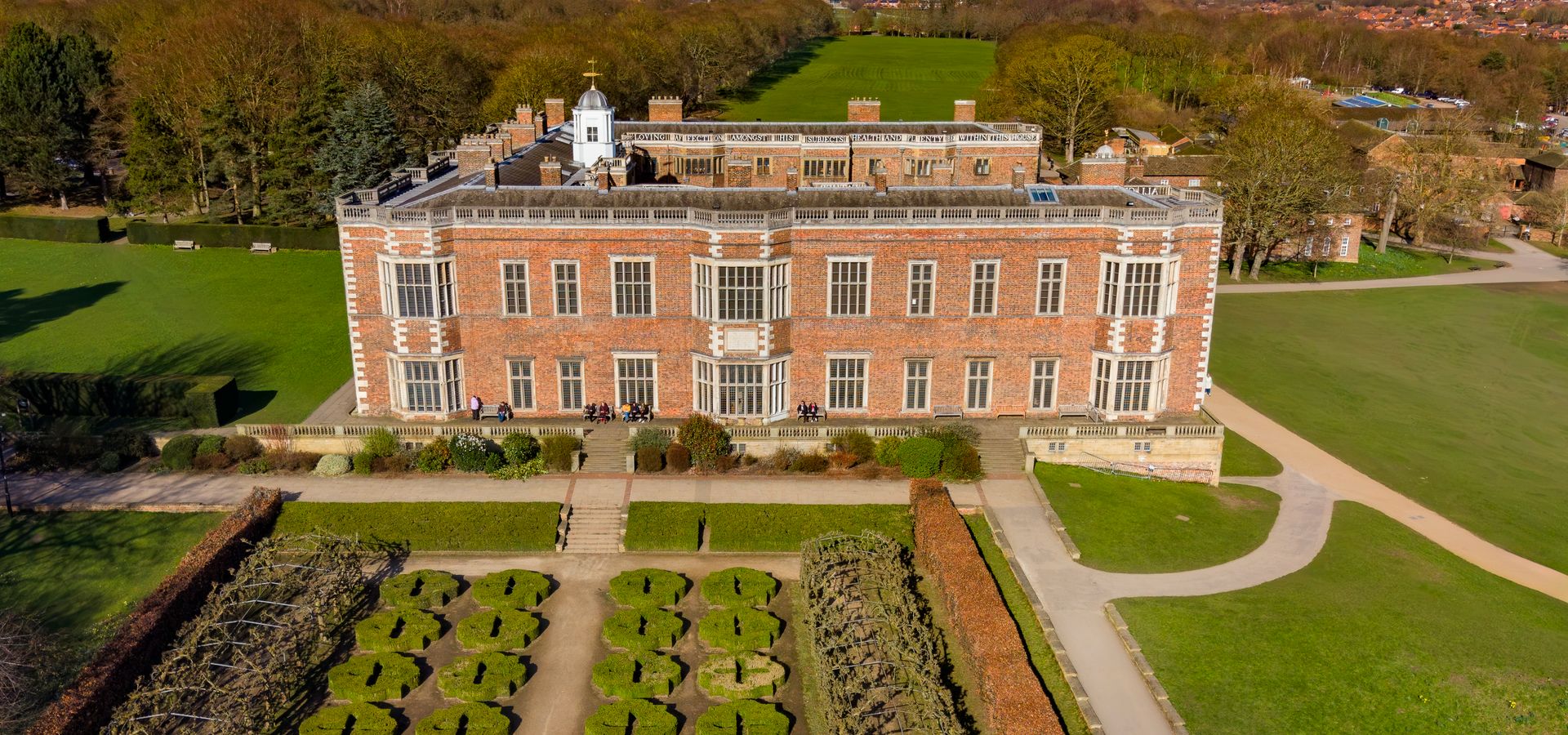 An airel image of Temple Newsam House, a large heritage house with garden and hedgeway views across Leeds