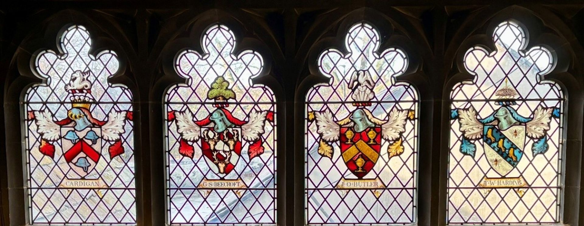 , a series of stained-glass windows installed during this period depict the coats of arms of various former inhabitants – the Cardigan, Beecroft, Butler, and Harding families. 